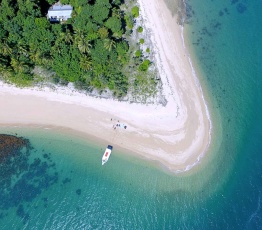 Boat sitting off the coast of Dunk Island on the Great Barrier Reef Australia