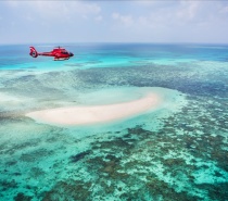 board a luxury Nautilus Aviation Helicopter for a 10-minute scenic flight to see the magical colours of the reef from the air
