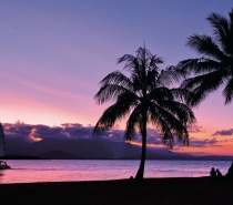 Soak up the peace and tranquillity of a tropical sunset over the Coral Sea as you sail along the coast off Port Douglas.