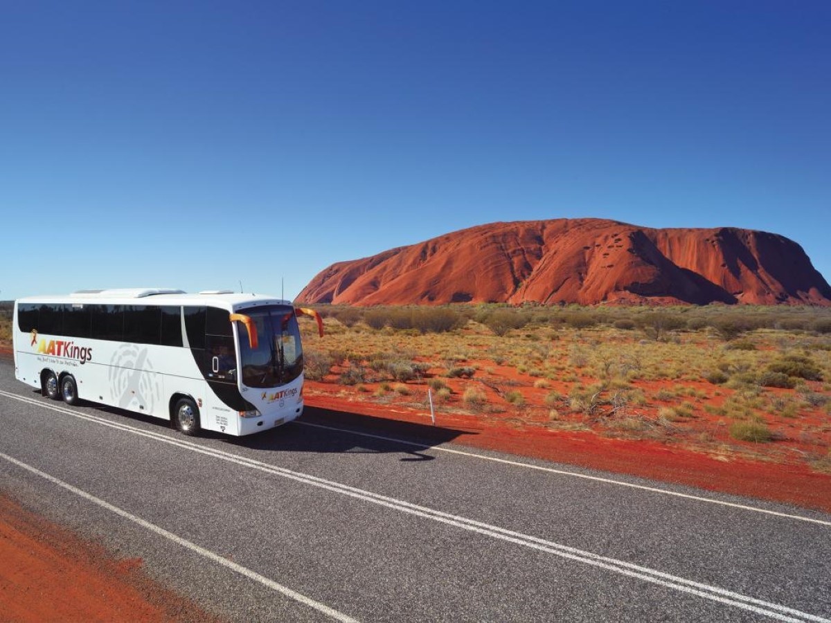 Tour Bus passing Uluru