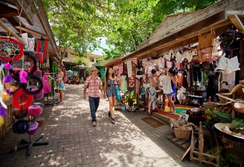 A woman walking around the Kuranda Markets